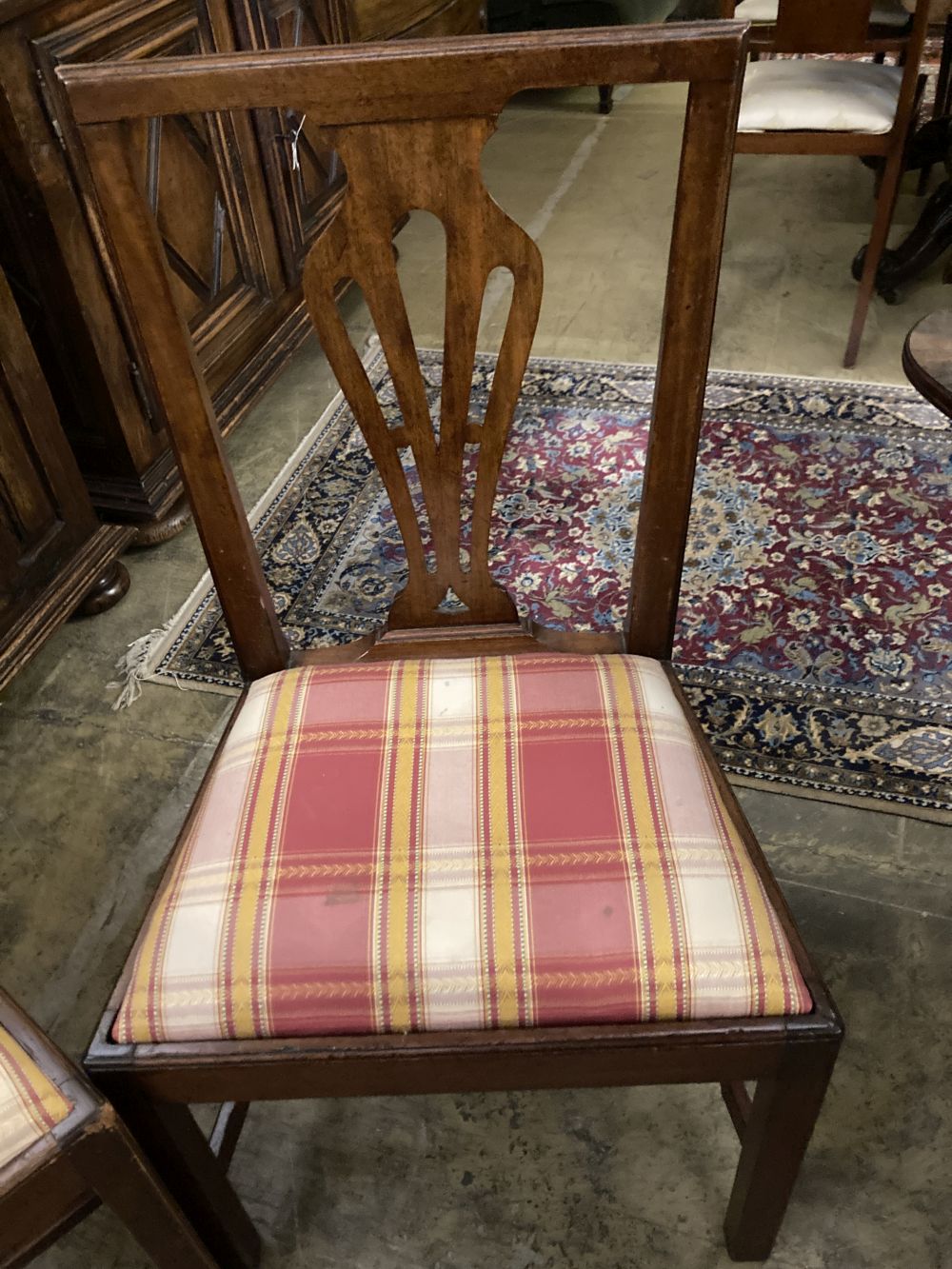 A set of ten George III country Chippendale mahogany dining chairs, W.1ft 7.5in. H.3ft 1.5in.